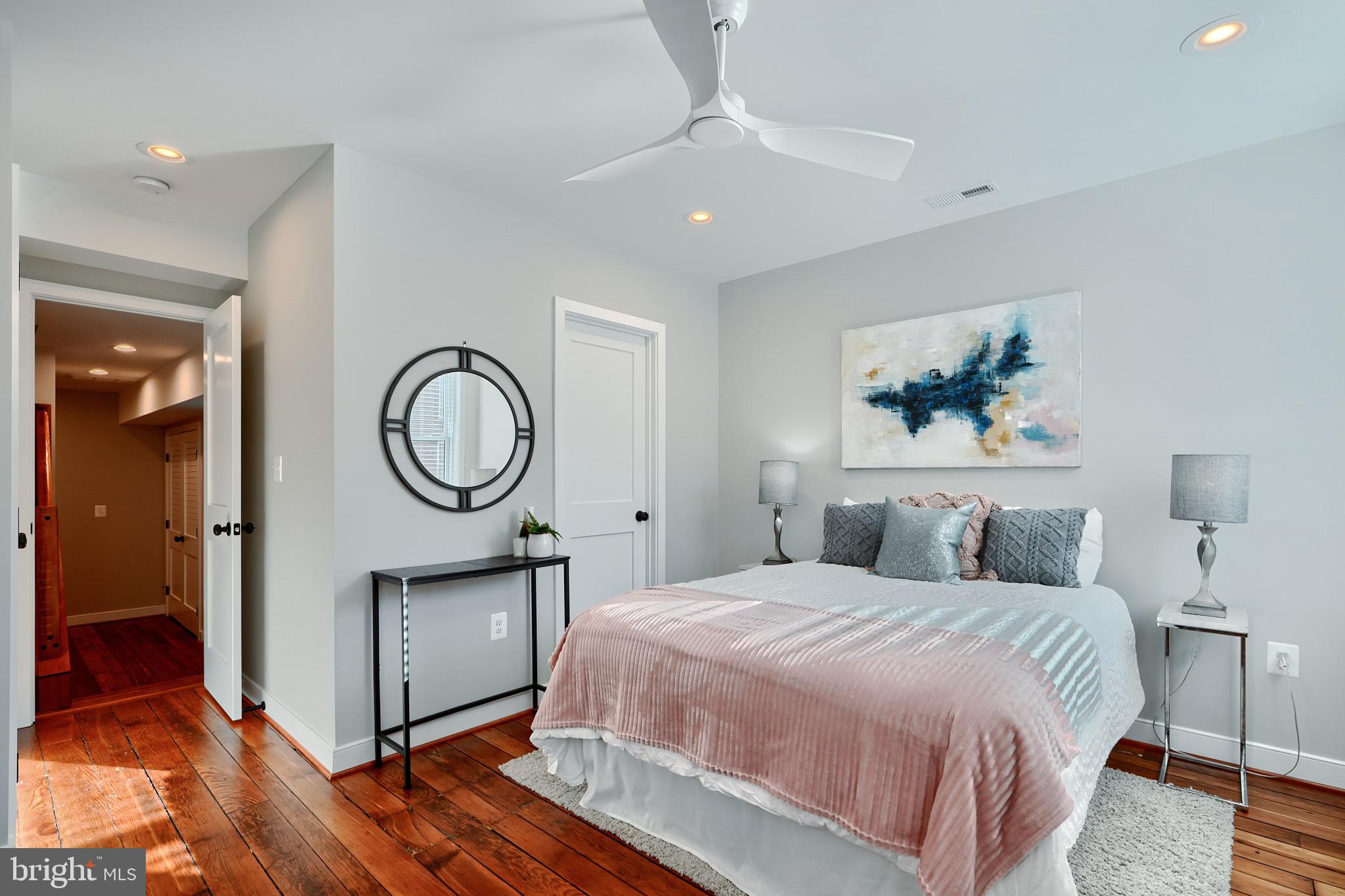 1435 Riverside Avenue Baltimore, MD 21230 - Photo 40 of 78 a bedroom with a bed and a chandelier