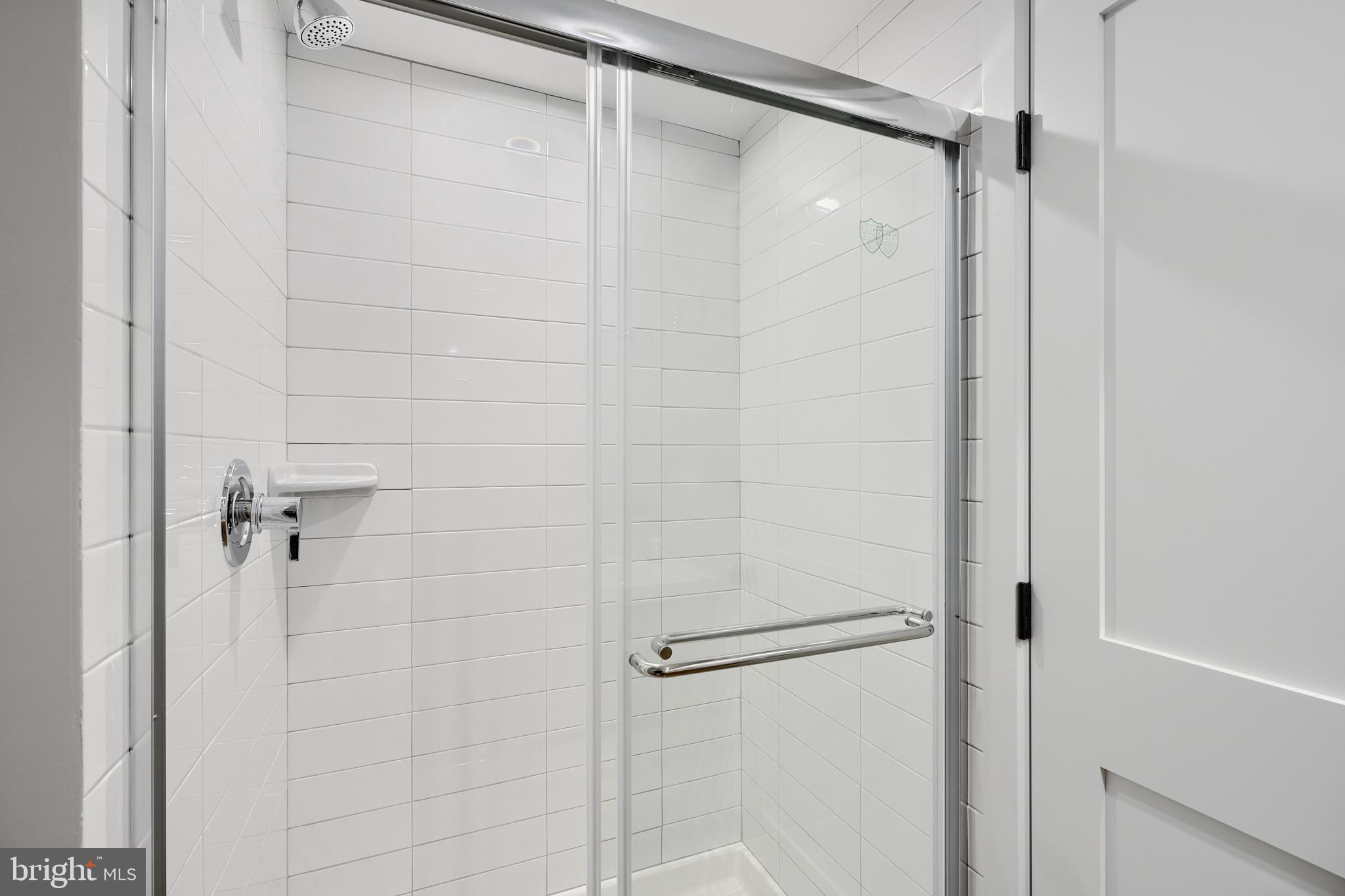 1435 Riverside Avenue Baltimore, MD 21230 - Photo 46 of 78 a bathroom with a glass shower door