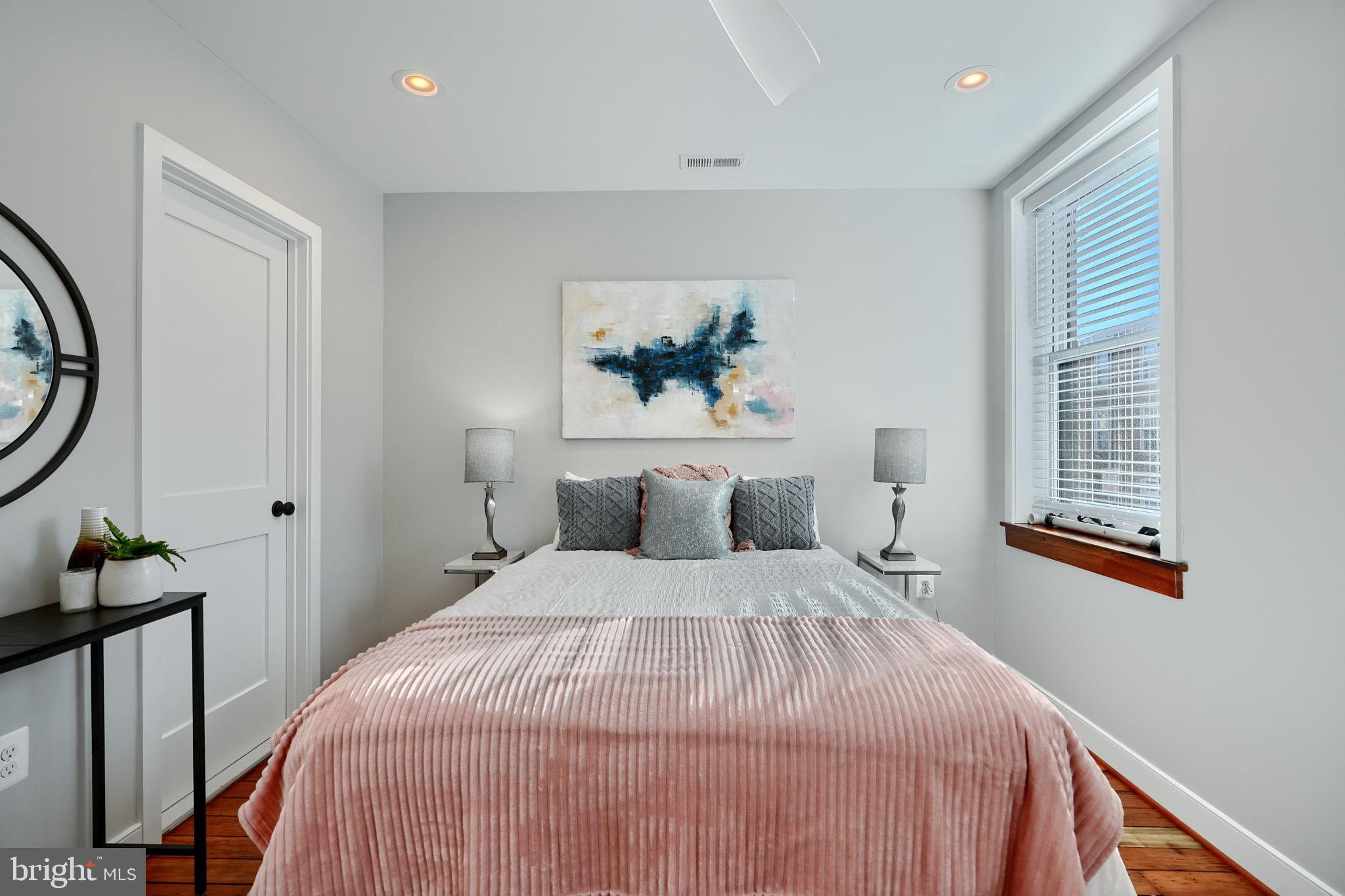 1435 Riverside Avenue Baltimore, MD 21230 - Photo 47 of 78 a large bed sitting in a bedroom next to a window