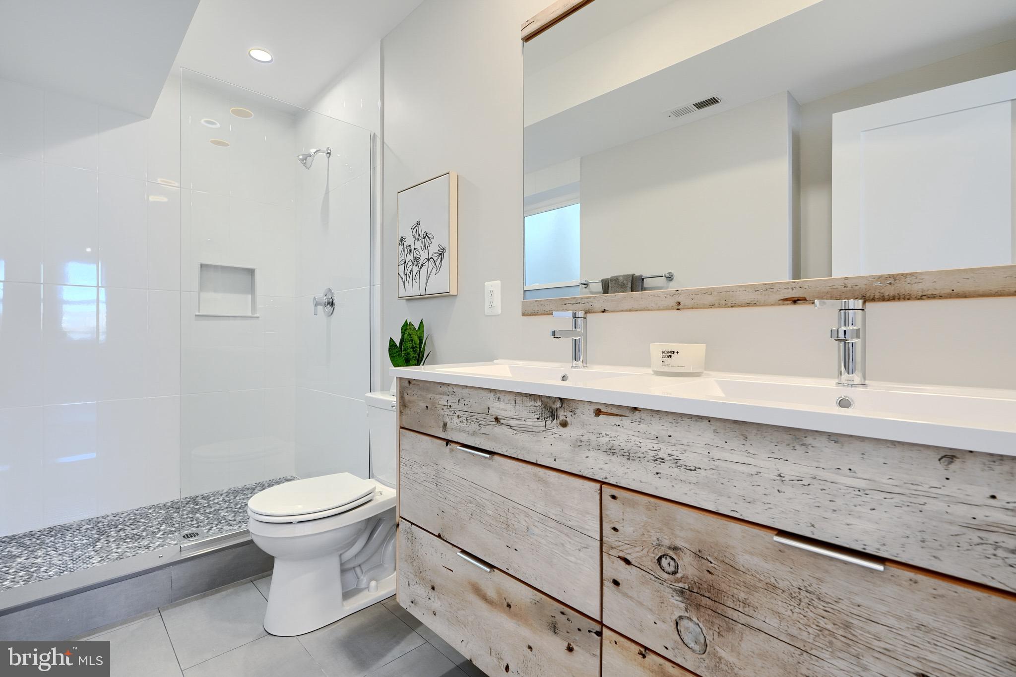 1435 Riverside Avenue Baltimore, MD 21230 - Photo 50 of 78 a bathroom with a sink a toilet and a mirror