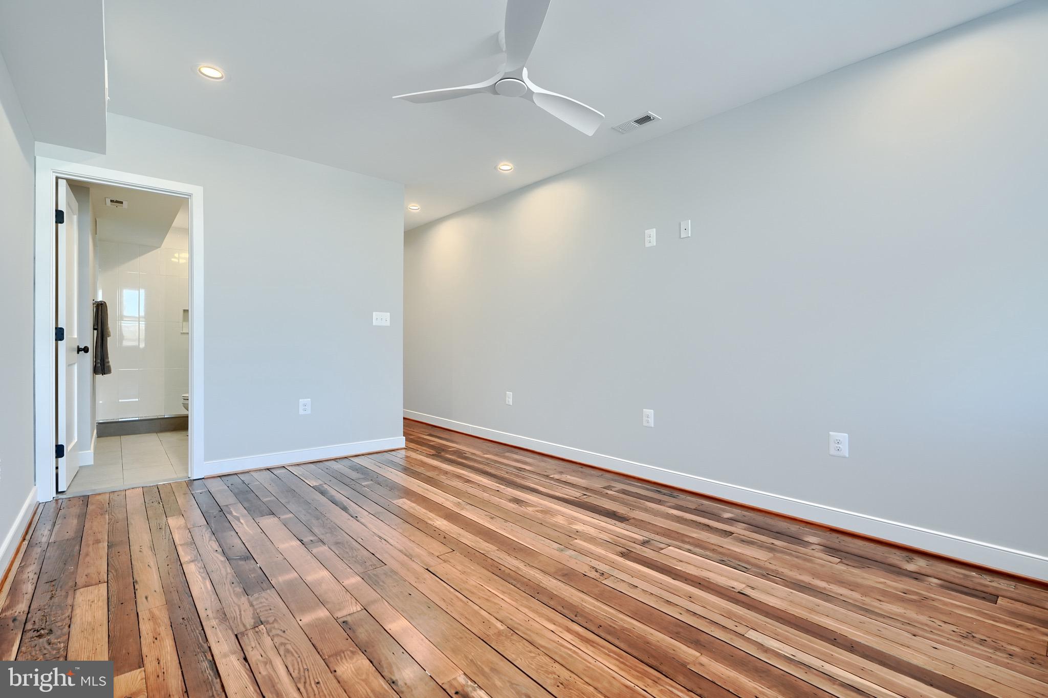 1435 Riverside Avenue Baltimore, MD 21230 - Photo 53 of 78 wooden floor in an empty room with a window