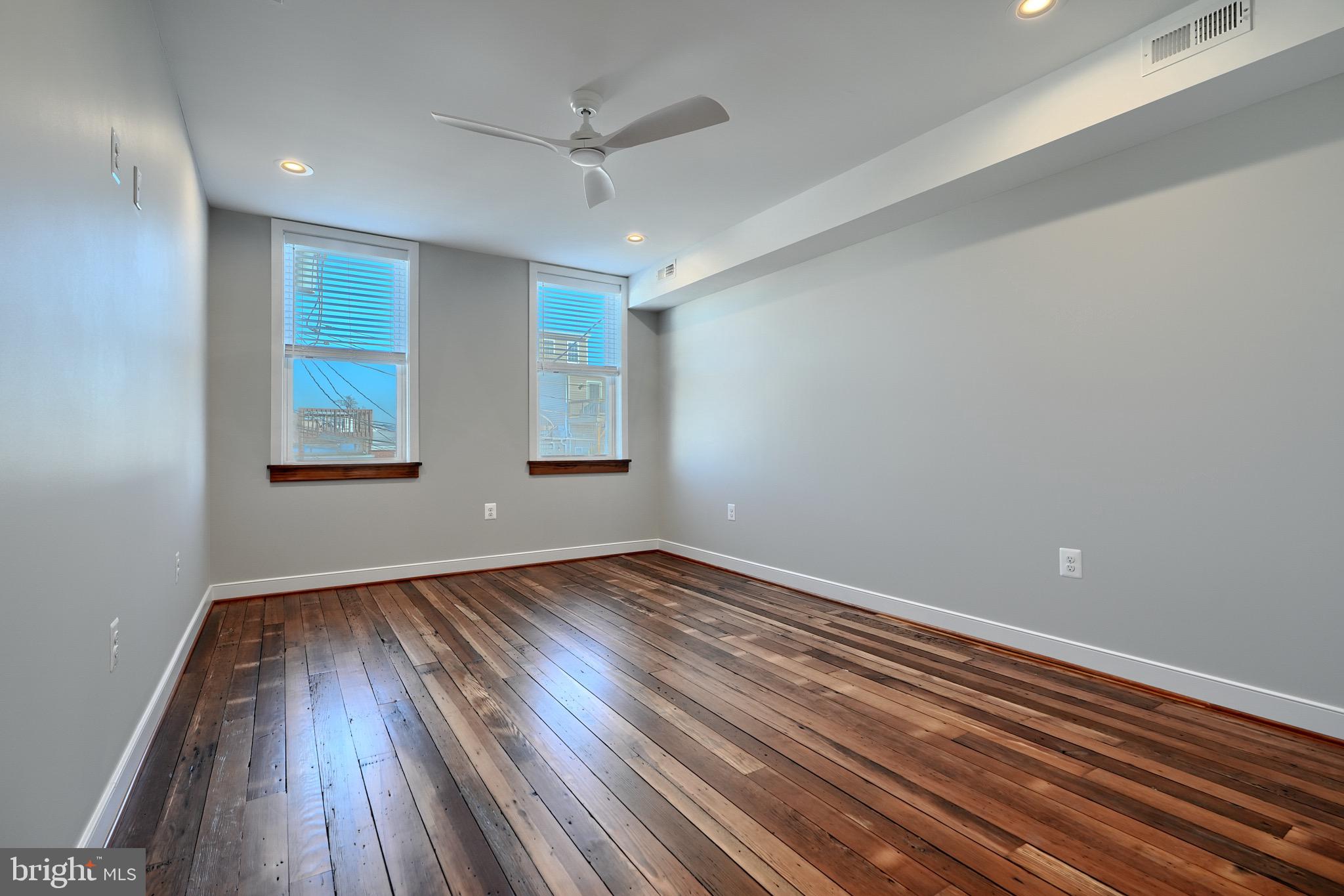 1435 Riverside Avenue Baltimore, MD 21230 - Photo 54 of 78 wooden floor in an empty room with a window
