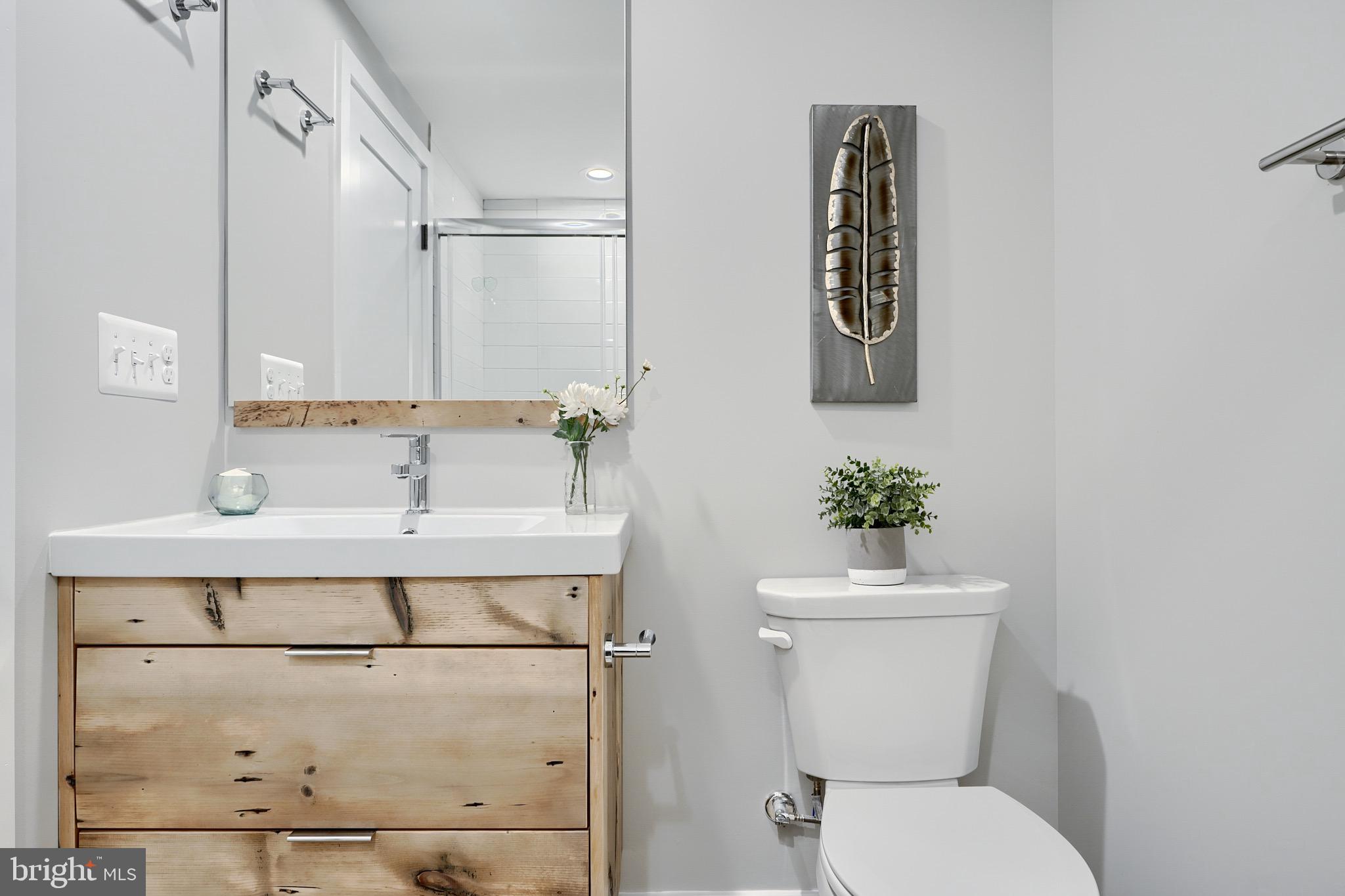 1435 Riverside Avenue Baltimore, MD 21230 - Photo 56 of 78 a bathroom with a sink a toilet and shower