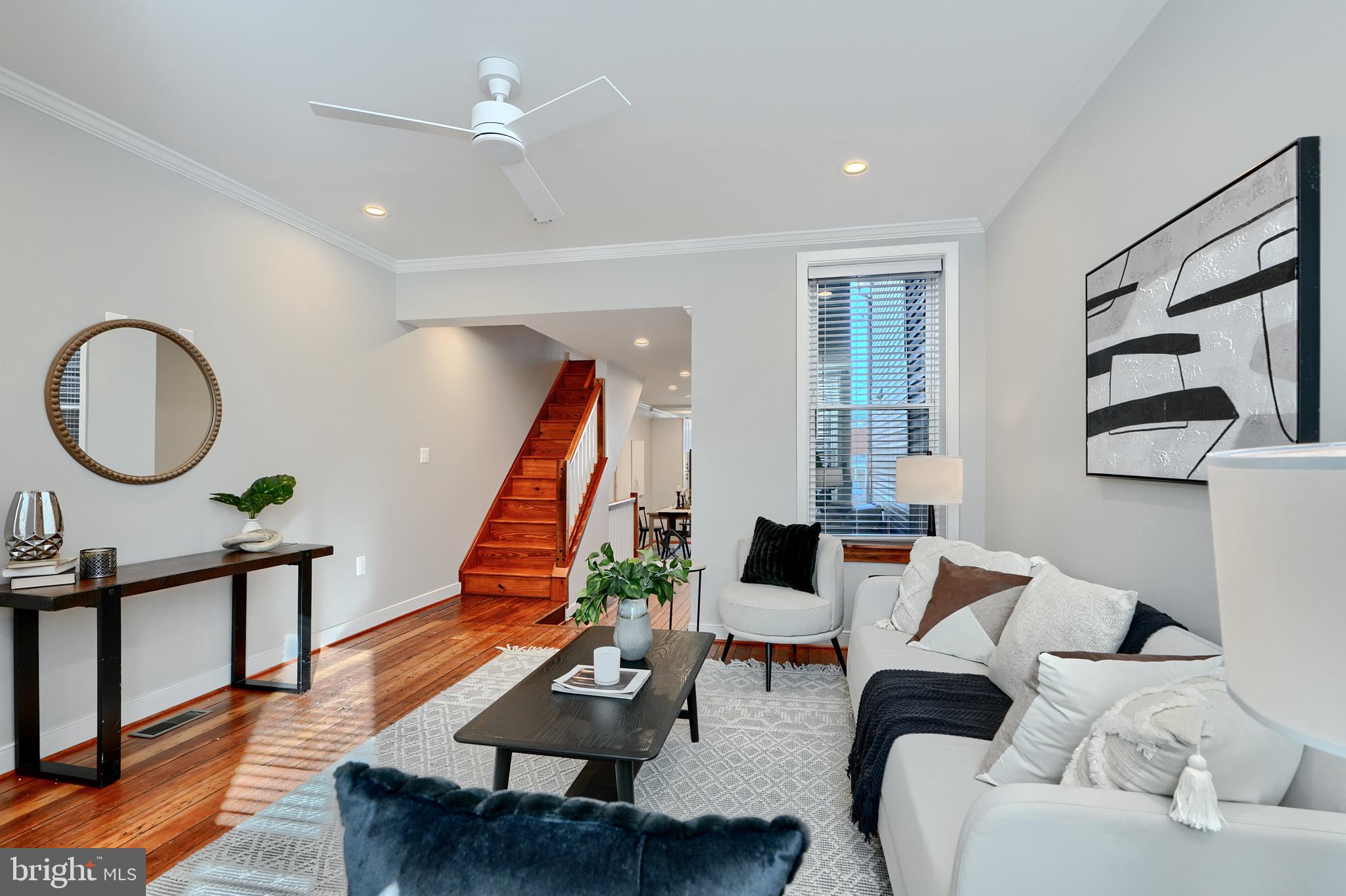 1435 Riverside Avenue Baltimore, MD 21230 - Photo 8 of 78 a living room with furniture a rug and a wooden floor
