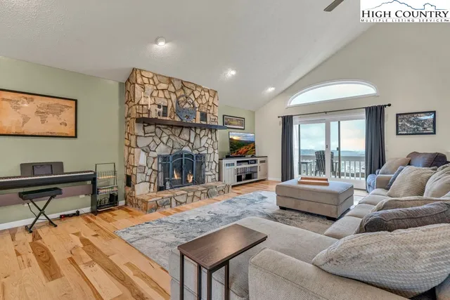 a kitchen with stainless steel appliances kitchen island granite countertop a sink counter top space cabinets and a window