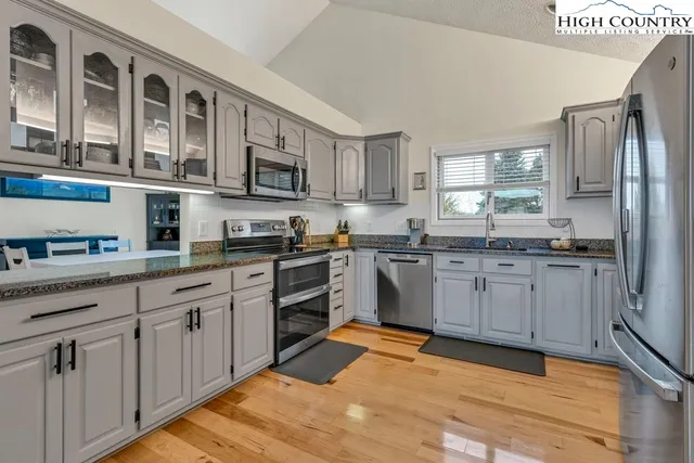 a view of walk in closet with clothes