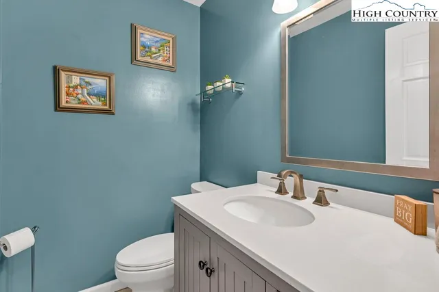 a bedroom with a bed and a television