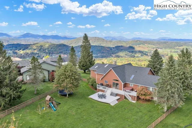 a kitchen with stainless steel appliances granite countertop a refrigerator sink and stove