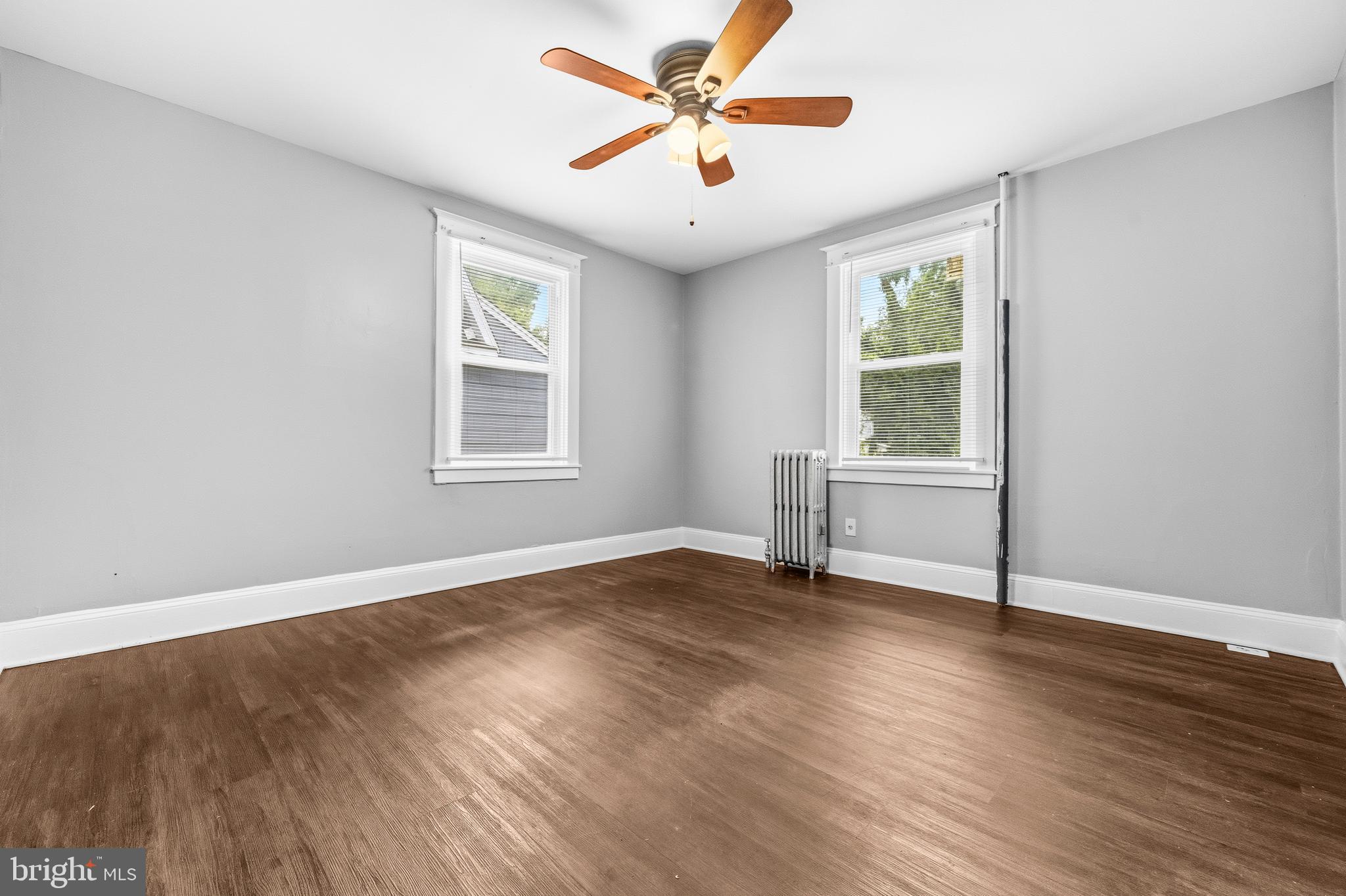 12 Leeway Dundalk, MD 21222 - Photo 9 of 34 an empty room with wooden floor and windows