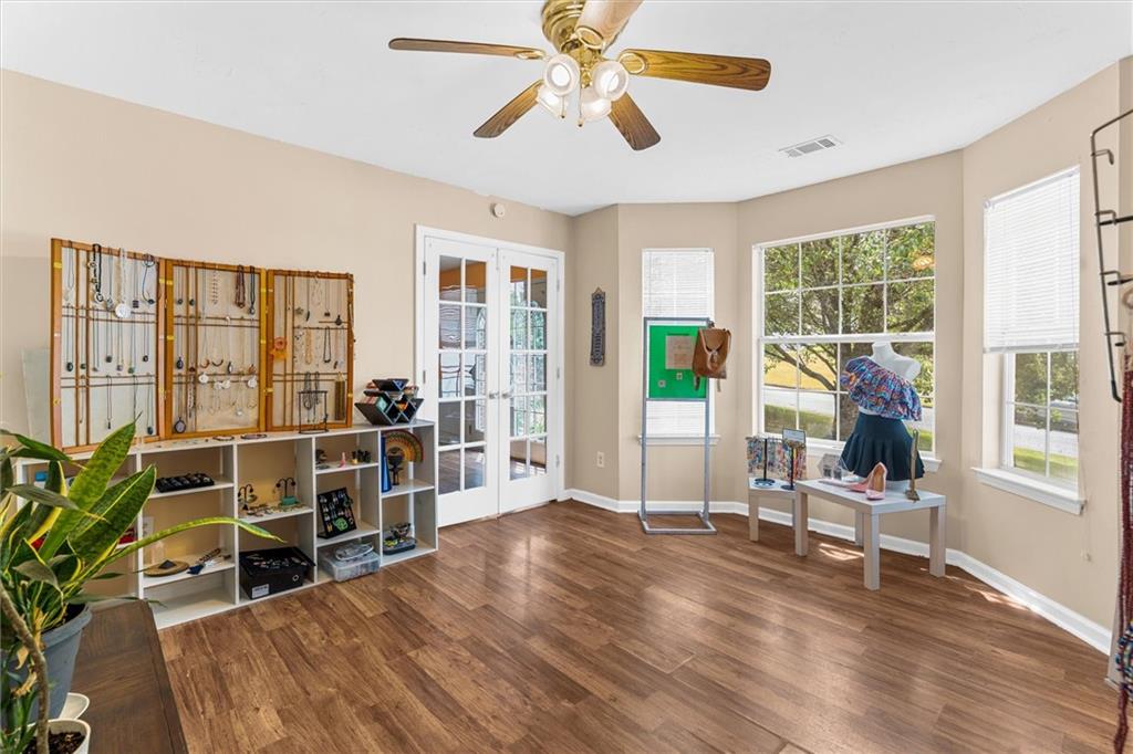 3234 Mineral Ridge Lane Stone Mountain, GA 30087 - Photo 21 of 55 a living room with furniture and large windows