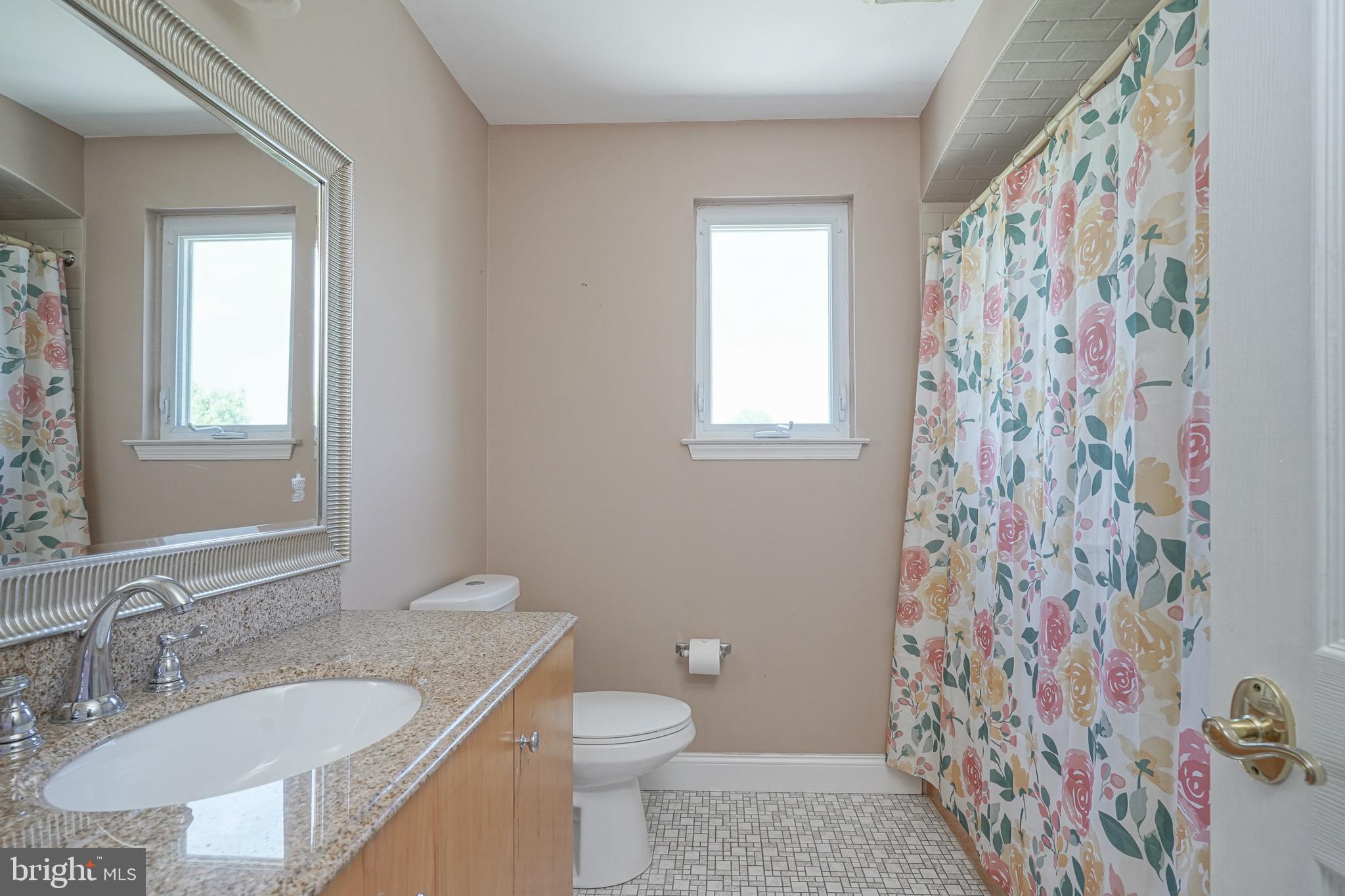 156 Country Farms Road Marlton, NJ 08053 - Photo 44 of 75 a bathroom with a granite countertop sink a toilet and a shower