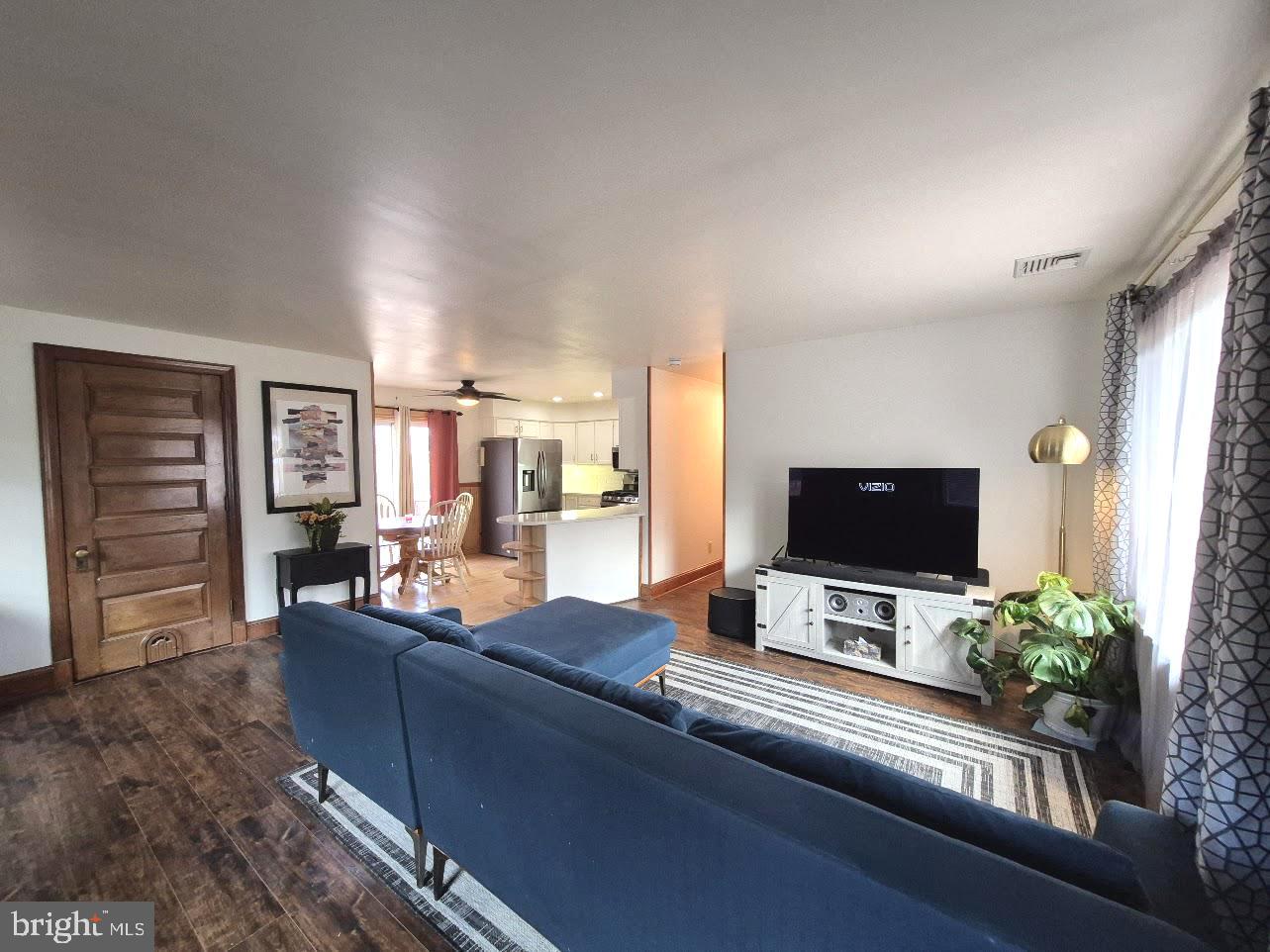 809 Jaguar Road Lindenwold, NJ 08021 - Photo 9 of 24 a living room with furniture and a flat screen tv