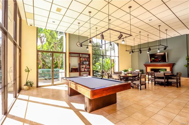 a living room with patio furniture and a large window