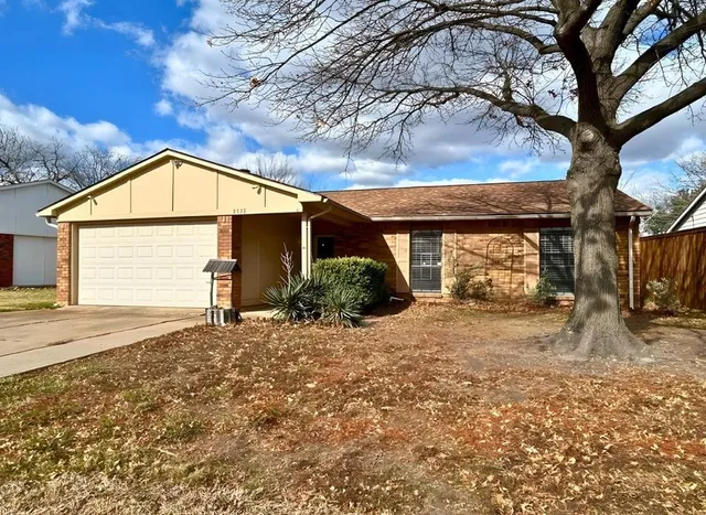 wooden floor in an empty room with a fireplace