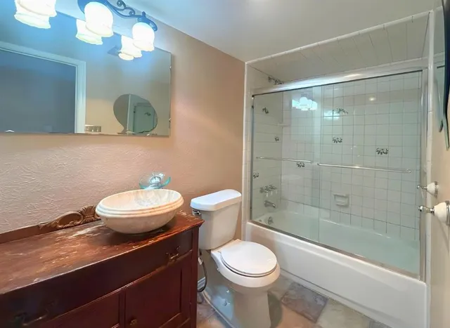 a view of a house with backyard porch and sitting area