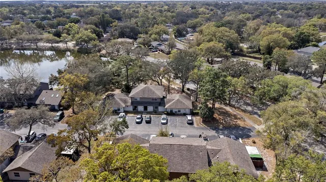 an aerial view of a house with lake view