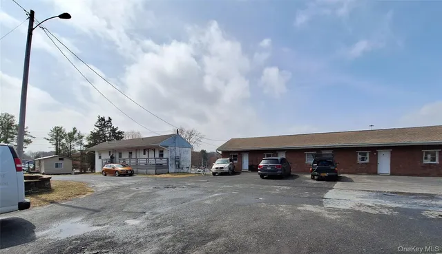 a view of a car parked in front of a building