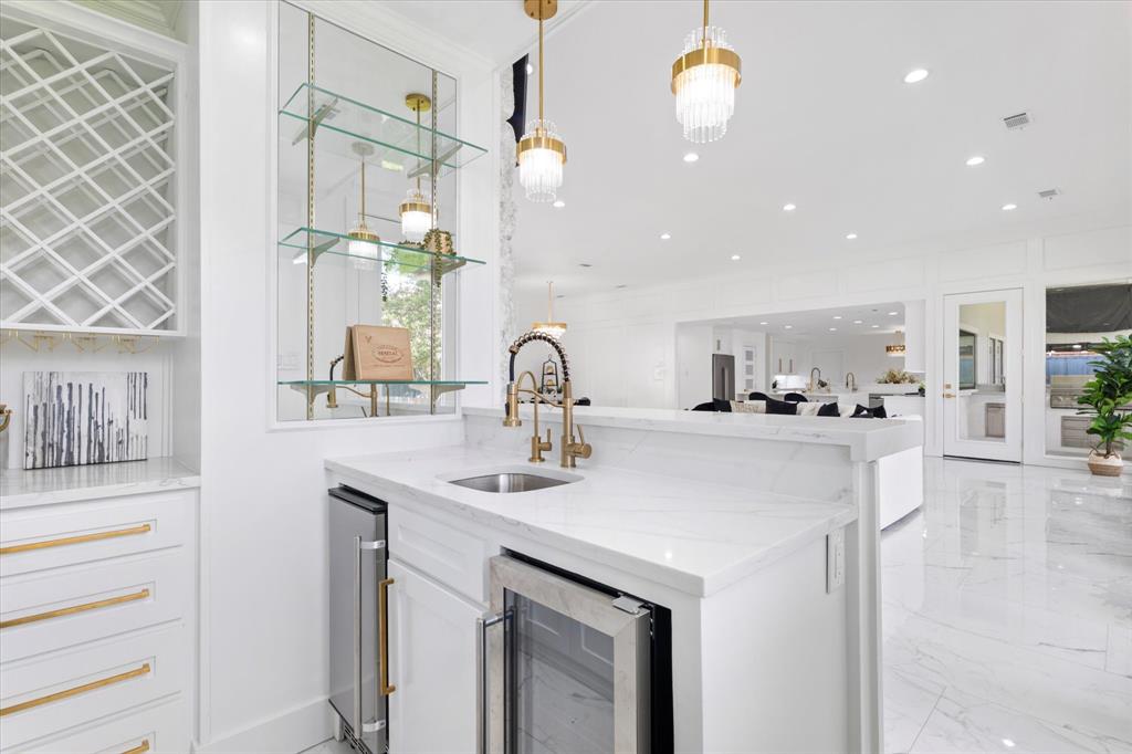 5407 Westgrove Drive Dallas, TX 75248 - Photo 15 of 40 a kitchen with a sink and a refrigerator
