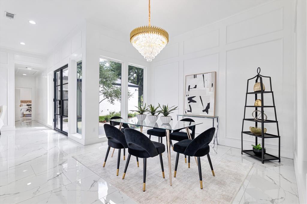 5407 Westgrove Drive Dallas, TX 75248 - Photo 17 of 40 a view of a dining room with furniture and a large window