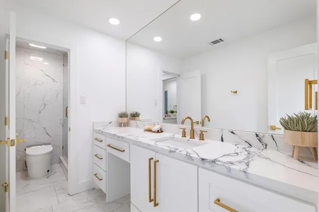 a utility room with sink dryer and washer