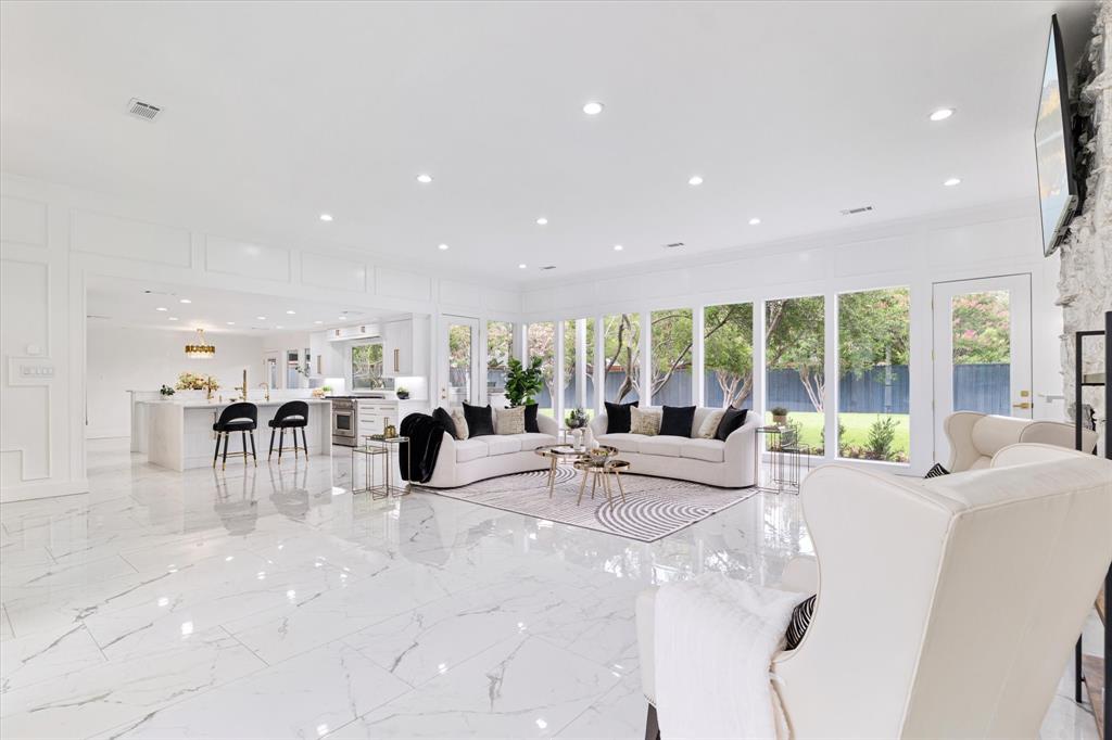 5407 Westgrove Drive Dallas, TX 75248 - Photo 5 of 40 a room with lots of tables a large window and chairs