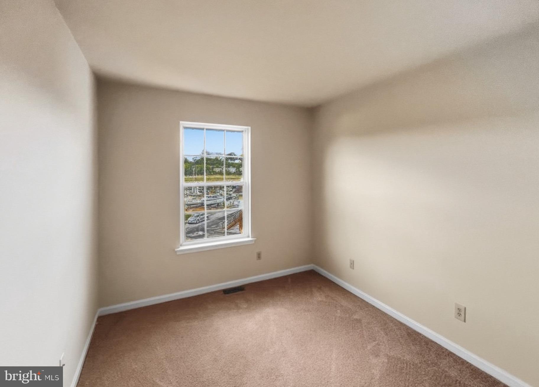 3607 Harbor Road Chesapeake Beach, MD 20732 - Photo 15 of 27 an empty room with a window