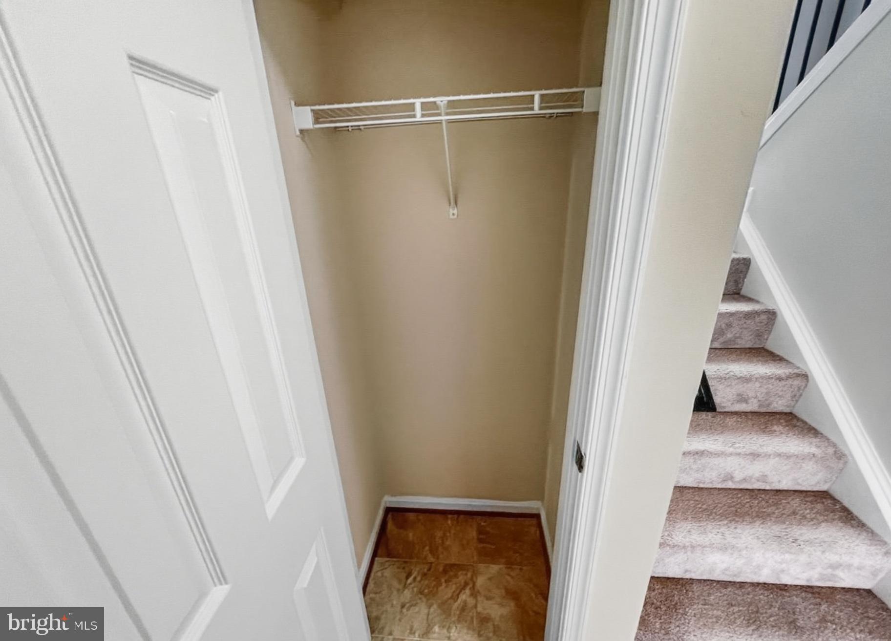 3607 Harbor Road Chesapeake Beach, MD 20732 - Photo 22 of 27 a view of a room with wooden floor and staircase