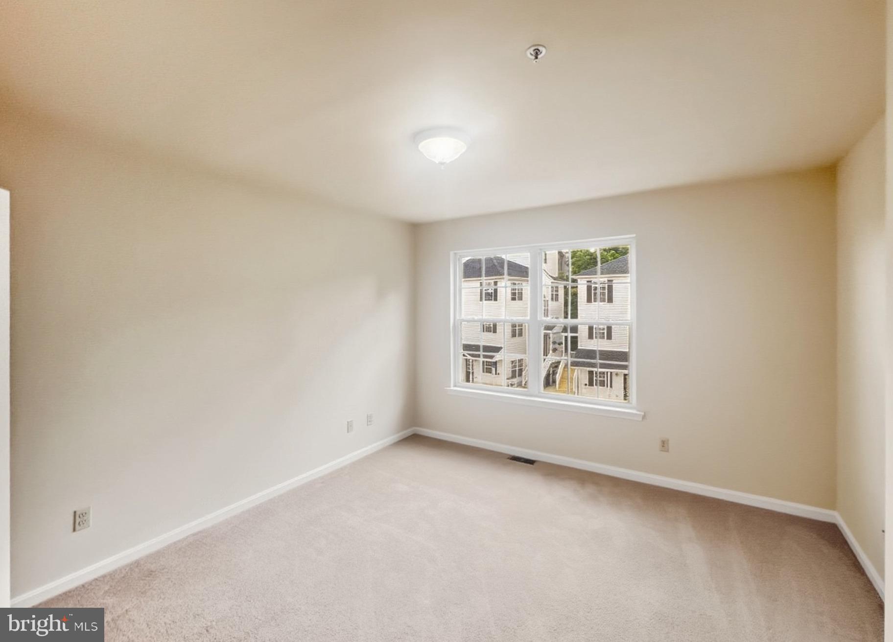 3607 Harbor Road Chesapeake Beach, MD 20732 - Photo 8 of 27 an empty room with a empty space and window