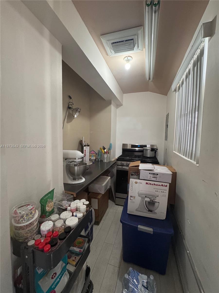 5252 Southwest 139th Place, Unit 5252 Miami, FL 33175 - Photo 12 of 18 a kitchen with a stove and a refrigerator