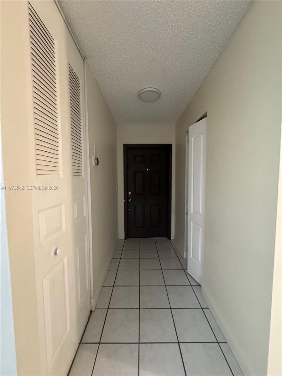 5252 Southwest 139th Place, Unit 5252 Miami, FL 33175 - Photo 7 of 15 a view of a hallway