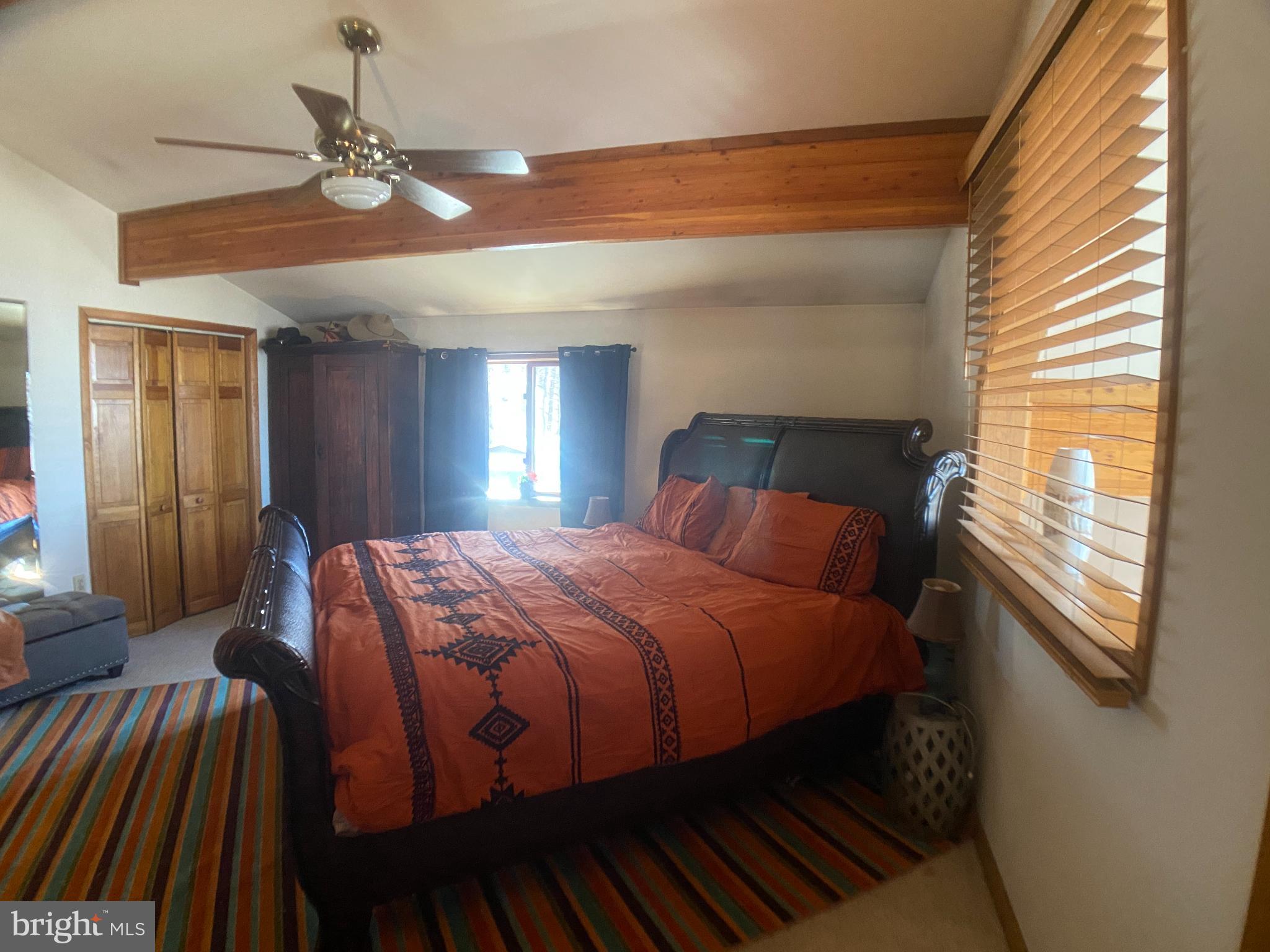 8939 Hawbottom Road Middletown, MD 21769 - Photo 29 of 92 a bed sitting in a bedroom next to a window