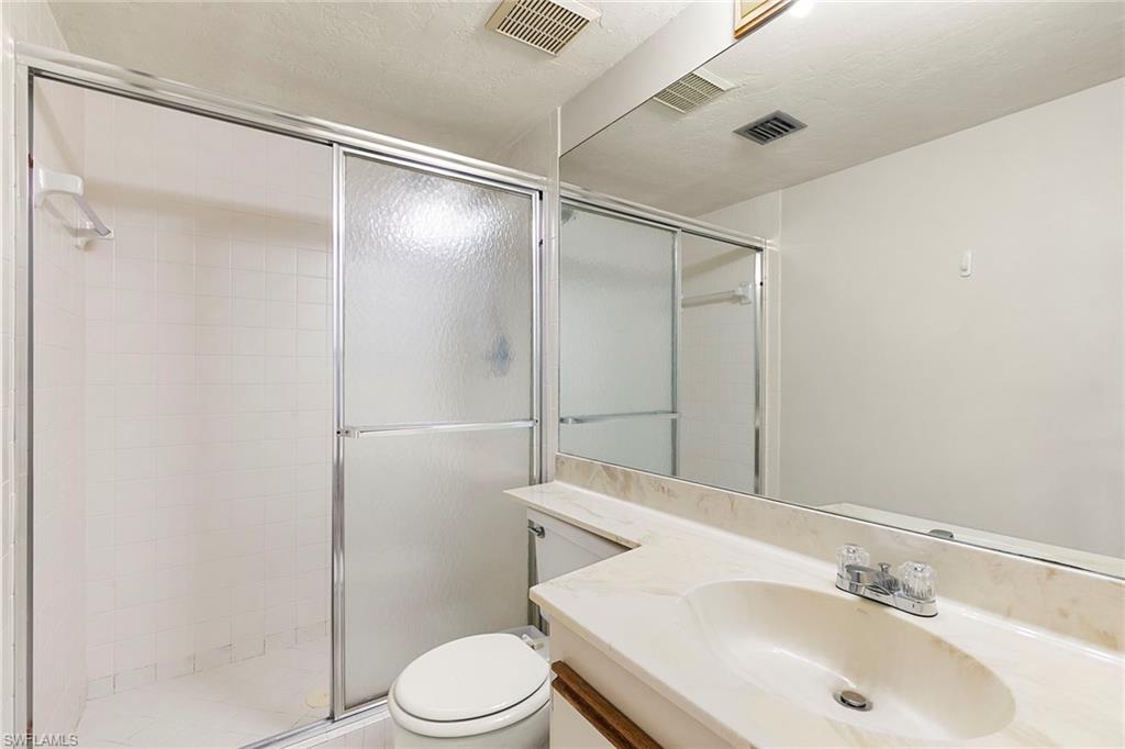 2189 San Marco Road, Unit 3201 Marco Island, FL 34145 - Photo 17 of 27 a bathroom with a sink toilet and shower