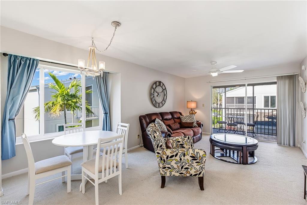 2189 San Marco Road, Unit 3201 Marco Island, FL 34145 - Photo 9 of 27 a living room with furniture and a table