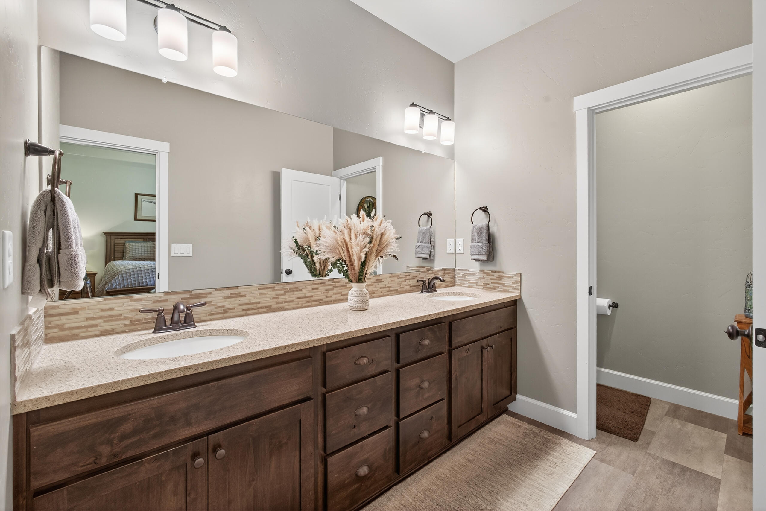 2793 Southwest 33rd Street Redmond, OR 97756 - Photo 20 of 44 a bathroom with a double vanity sink and a mirror