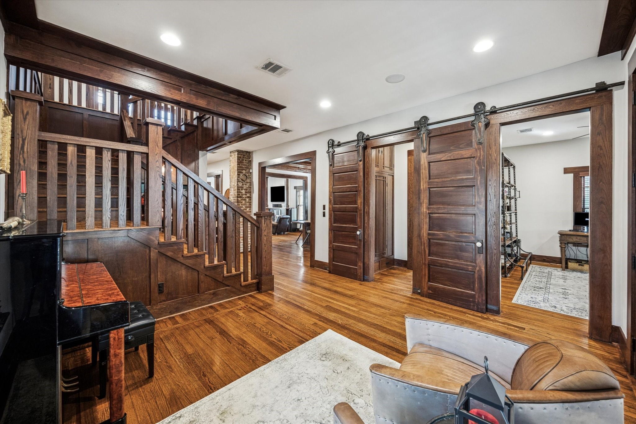 512 Archer Street Houston, TX 77009 - Photo 5 of 40 Timeless six-panel solid wood sliding doors on casters open to the fourth bedroom/office and a full bathroom.