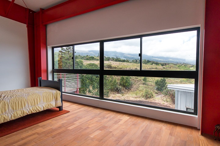 3 Piliwale Road Kula, HI 96790 - Photo 23 of 30 a living room with a large window and a bed
