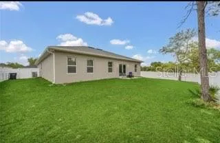 a view of a yard with a house