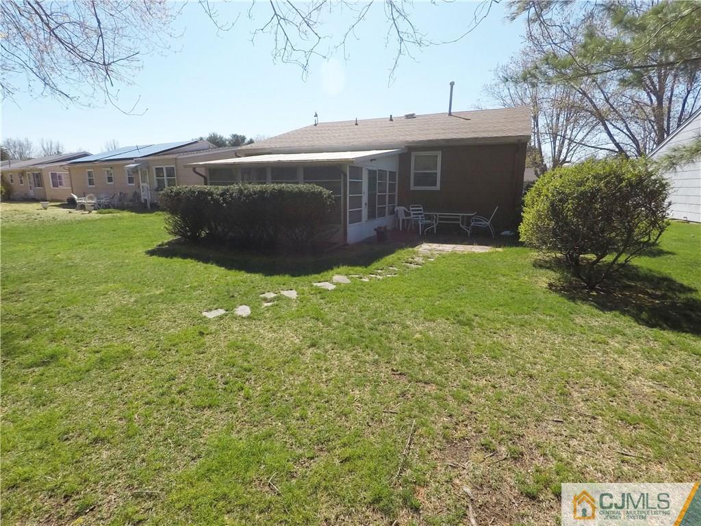 125 Georgetown Road Toms River, NJ 08757 - Photo 2 of 25 a view of backyard with seating area and green space