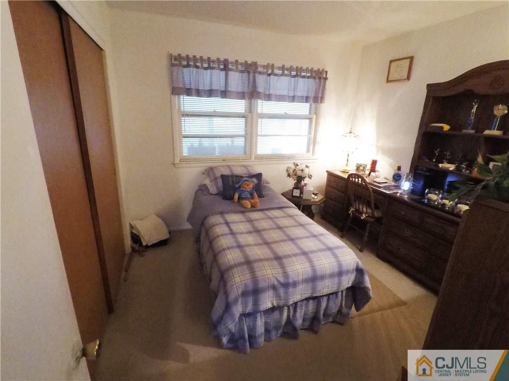 125 Georgetown Road Toms River, NJ 08757 - Photo 12 of 25 a bedroom with a bed and a window