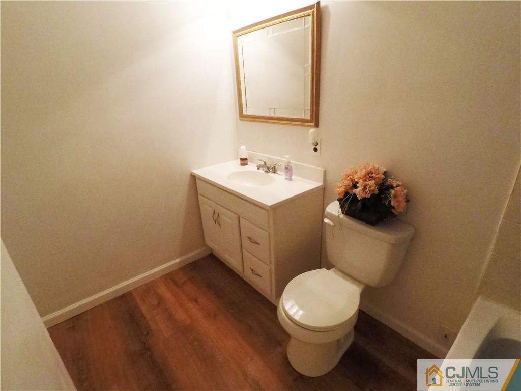 125 Georgetown Road Toms River, NJ 08757 - Photo 14 of 25 a bathroom with a sink and a toilet