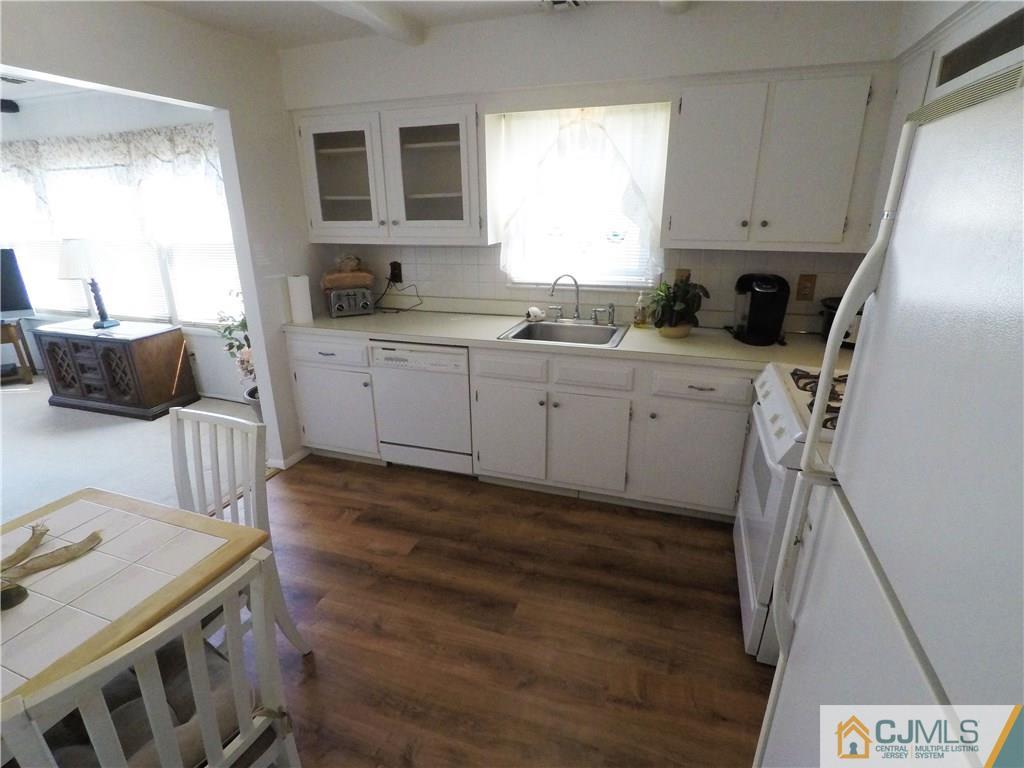 125 Georgetown Road Toms River, NJ 08757 - Photo 15 of 25 a kitchen with cabinets appliances and a window
