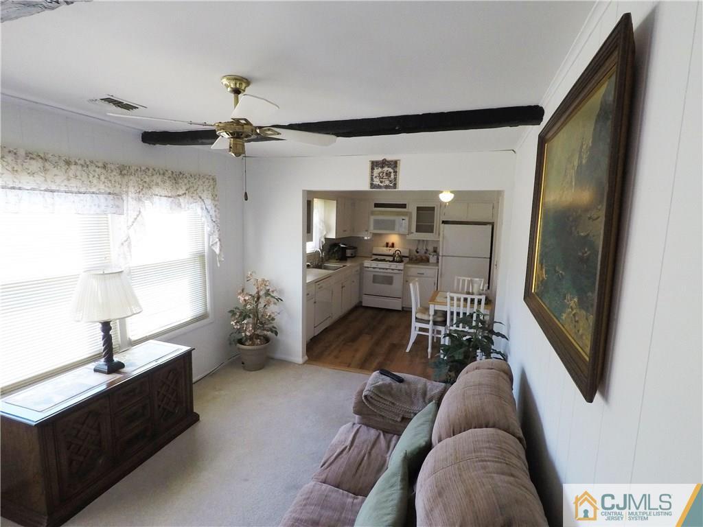 125 Georgetown Road Toms River, NJ 08757 - Photo 20 of 25 a living room with furniture and a flat screen tv