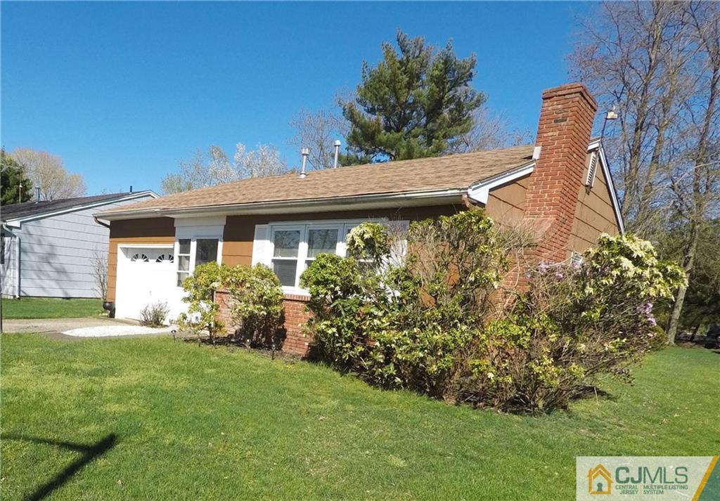 125 Georgetown Road Toms River, NJ 08757 - Photo 4 of 25 a front view of a house with garden