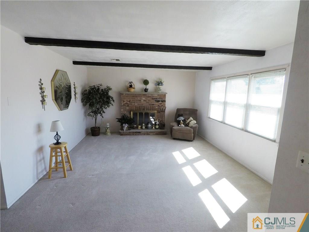 125 Georgetown Road Toms River, NJ 08757 - Photo 6 of 25 a view of livingroom with furniture and a window