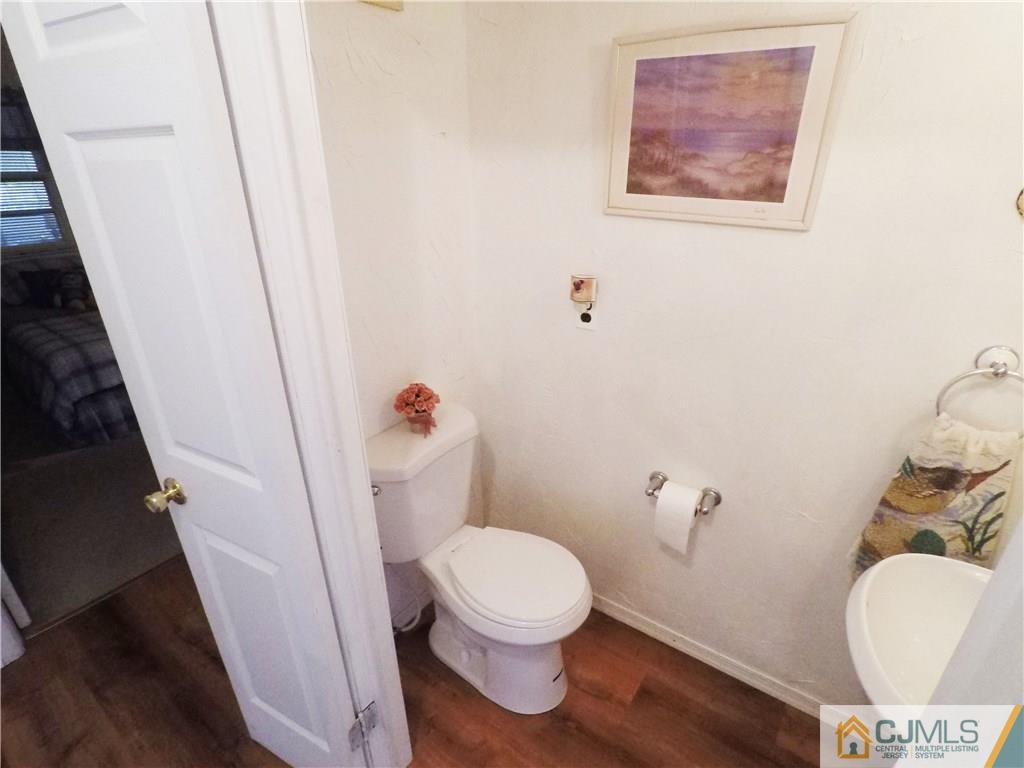 125 Georgetown Road Toms River, NJ 08757 - Photo 10 of 25 a white toilet sitting next to a small bathroom