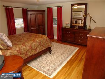 246 Harrogate Road Wynnewood, PA 19096 - Photo 8 of 12 a bedroom with a bed dresser and a dresser