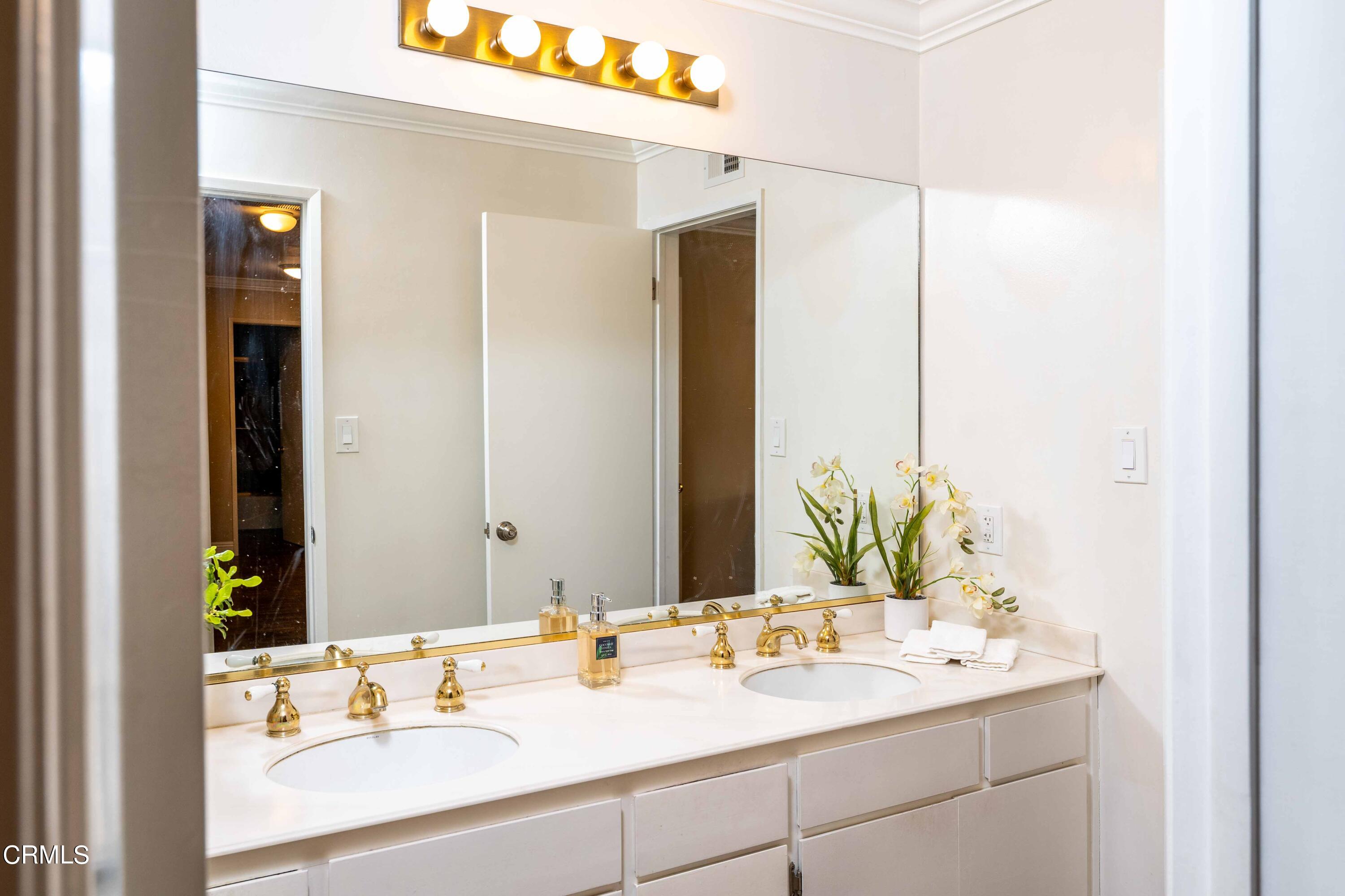 1038 Leandra Lane Arcadia, CA 91006 - Photo 21 of 36 a bathroom with a sink and a mirror