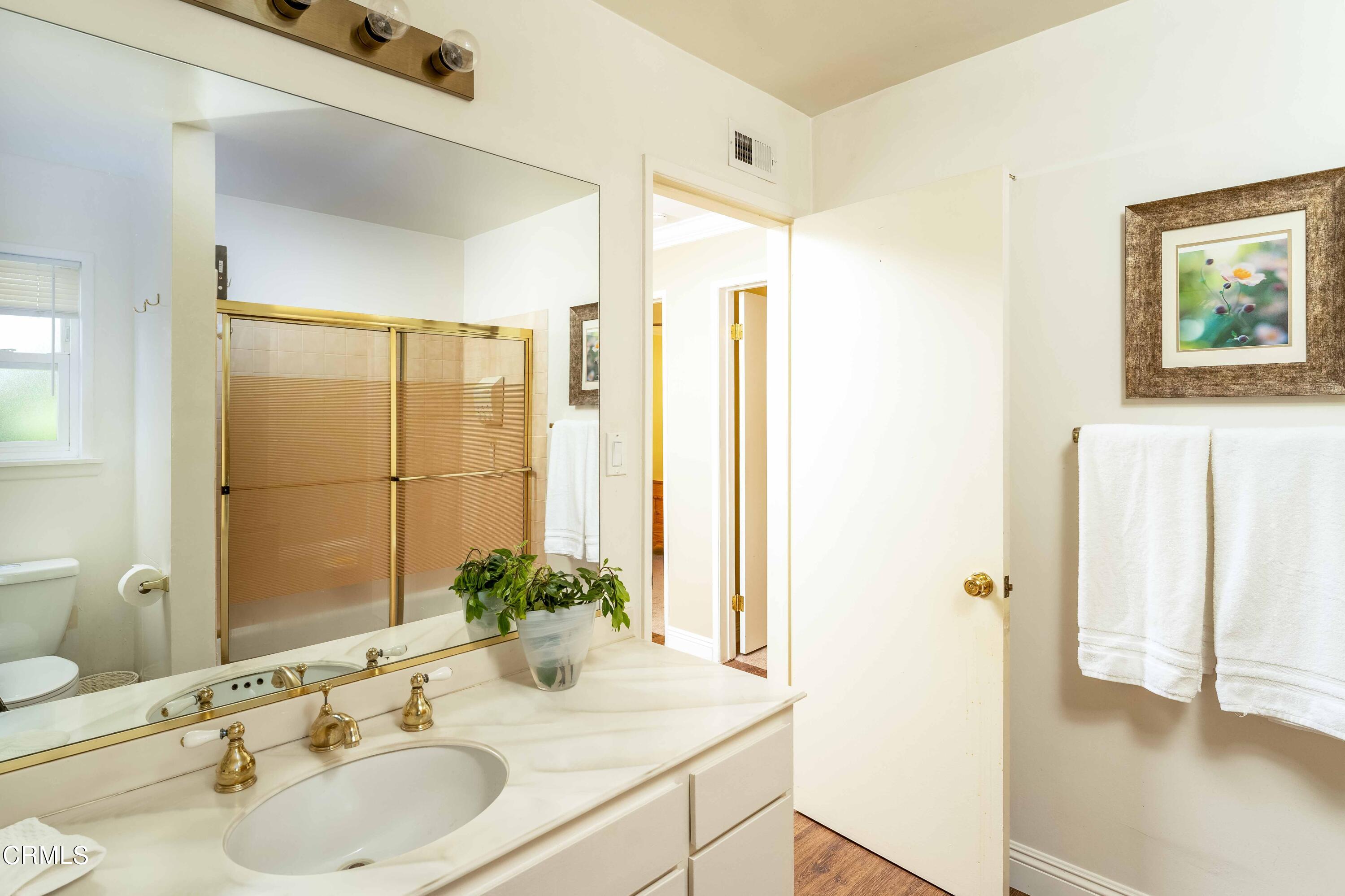 1038 Leandra Lane Arcadia, CA 91006 - Photo 27 of 36 a bathroom with a sink and a mirror
