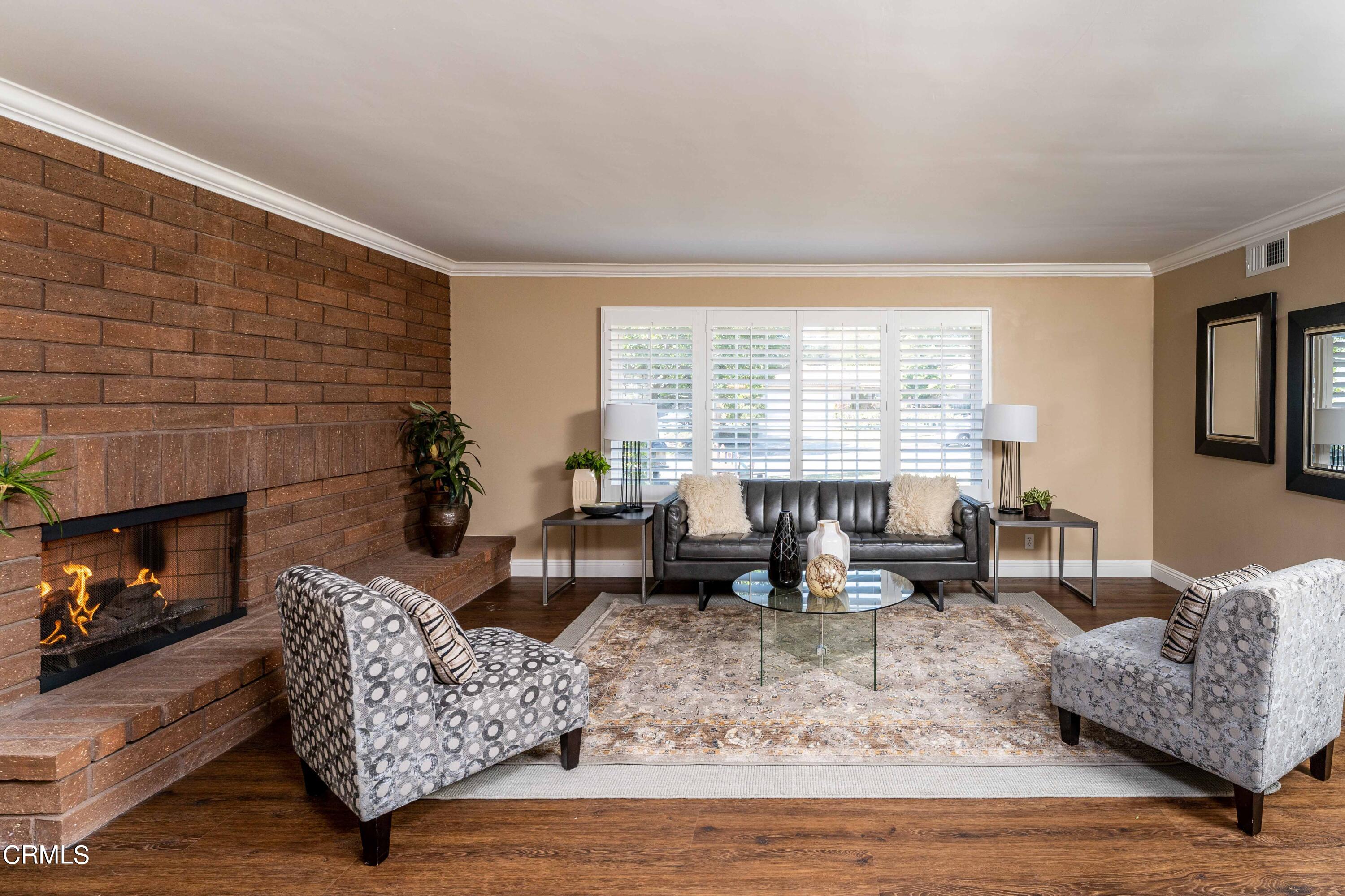 1038 Leandra Lane Arcadia, CA 91006 - Photo 7 of 36 a living room with furniture fireplace and a large window