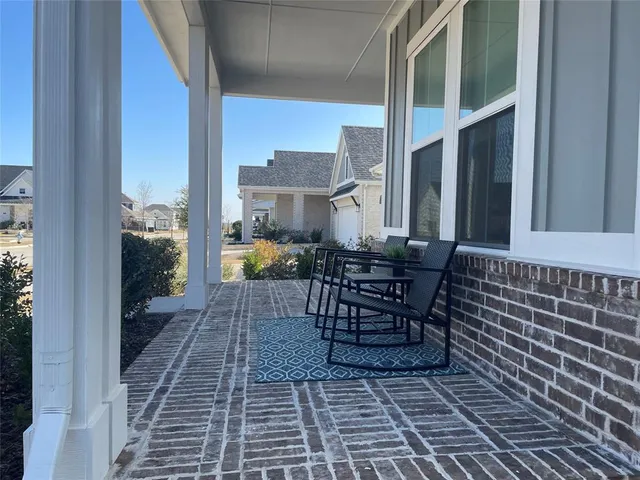 a view of a balcony with dining area